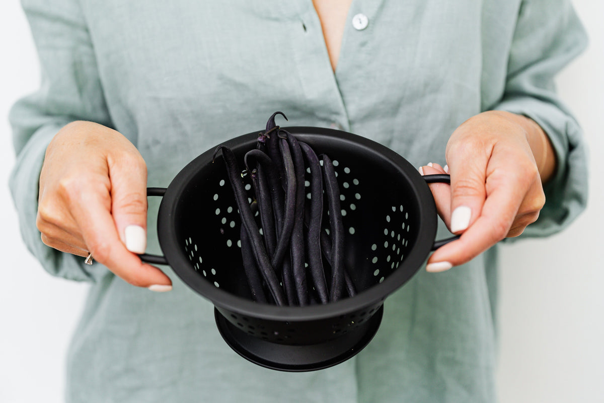 Flexible silicone colander held in both hands