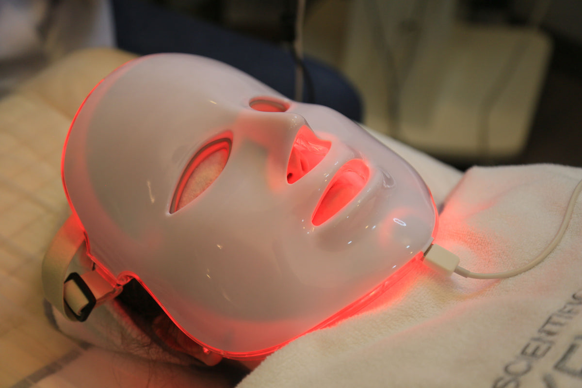LED light therapy facial mask device with red light worn on the face