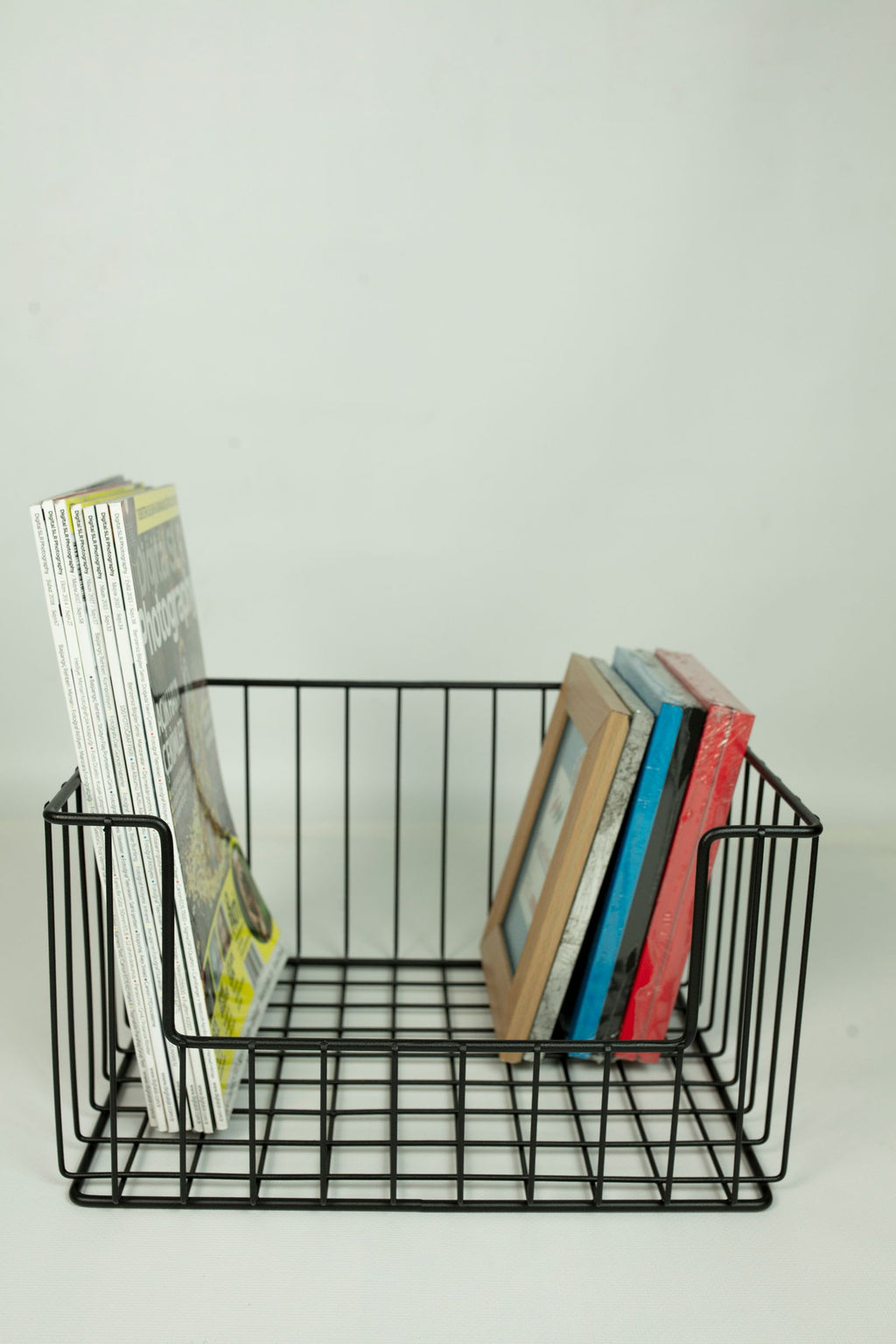 Wire basket holding items for storage