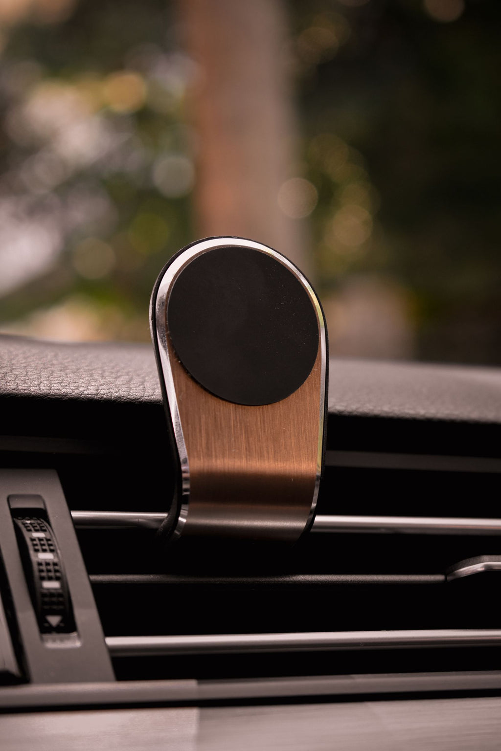 Magnetic phone holder mounted on car air vent