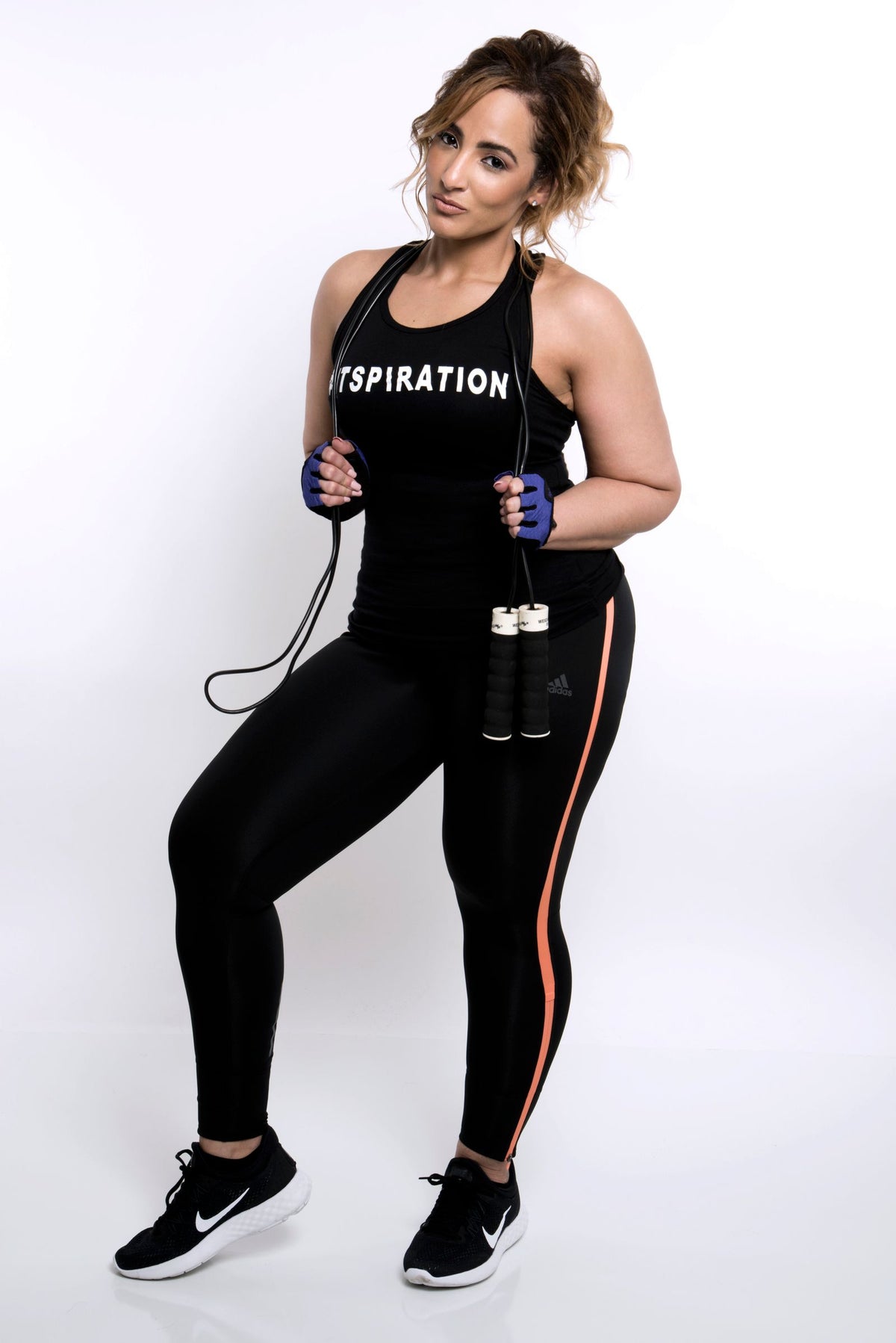 Woman posing with a jump rope