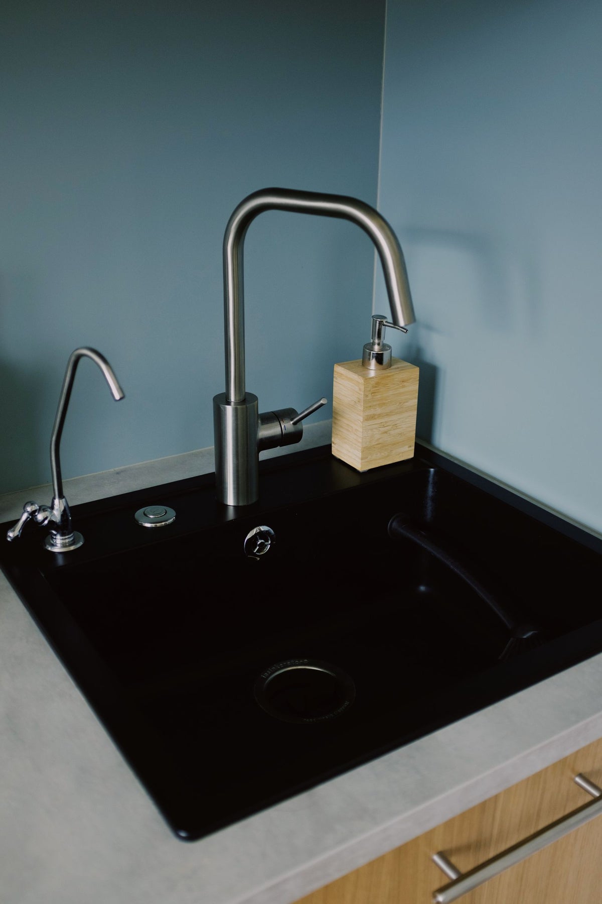 Sleek kitchen sink with soap dispenser