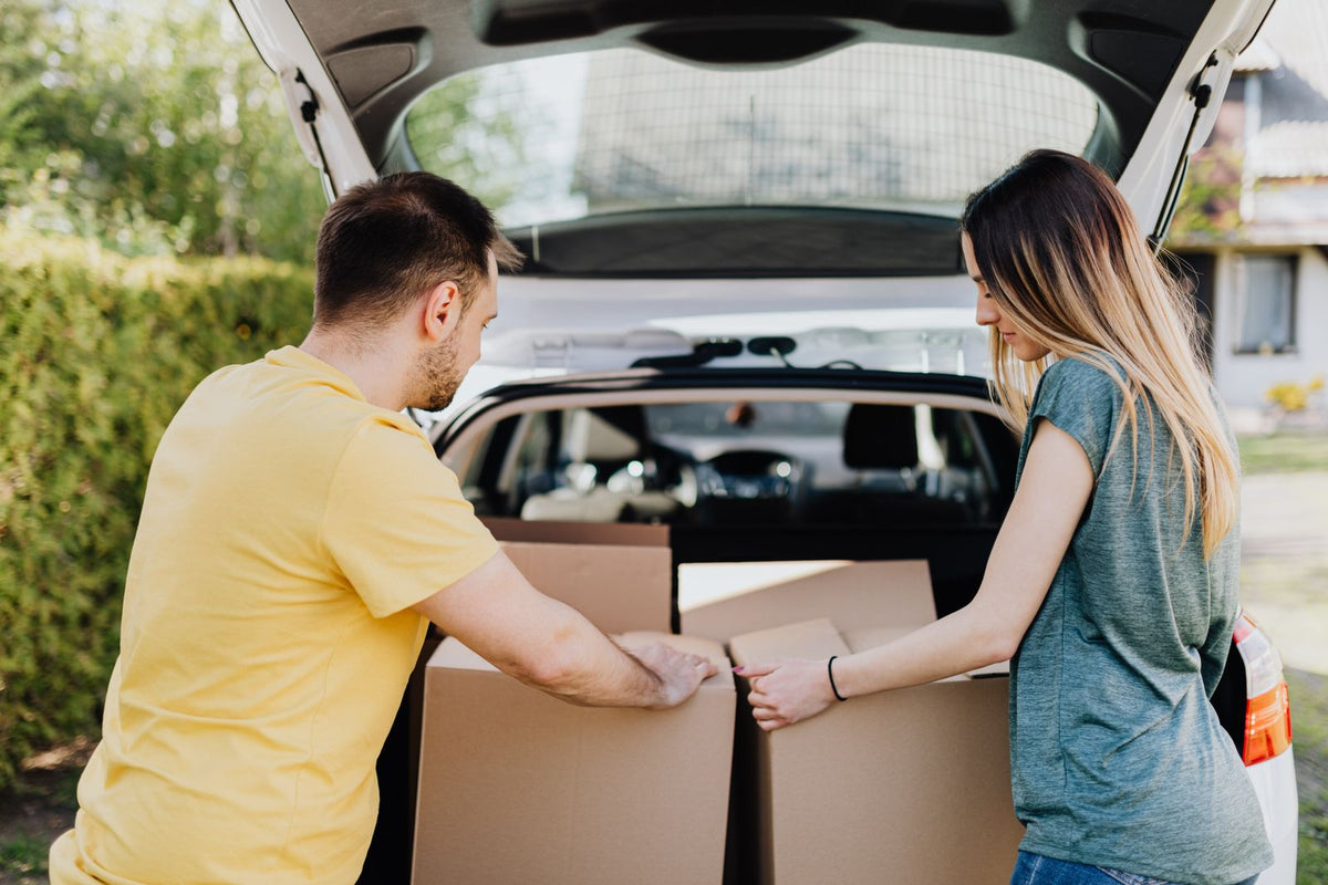 Loading boxes into a car trunk