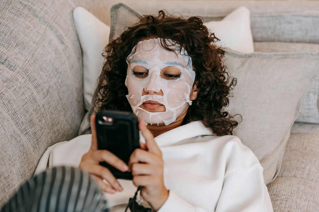 Woman wearing a hydrating sheet mask