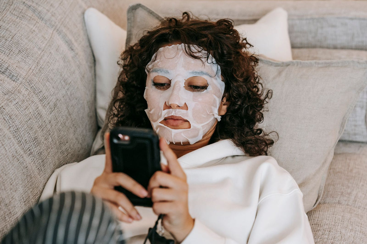 Woman wearing a hydrating sheet mask