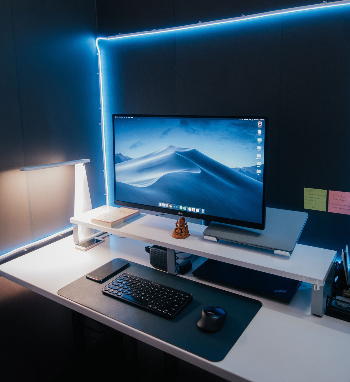 LED strip backlighting a monitor and desk setup