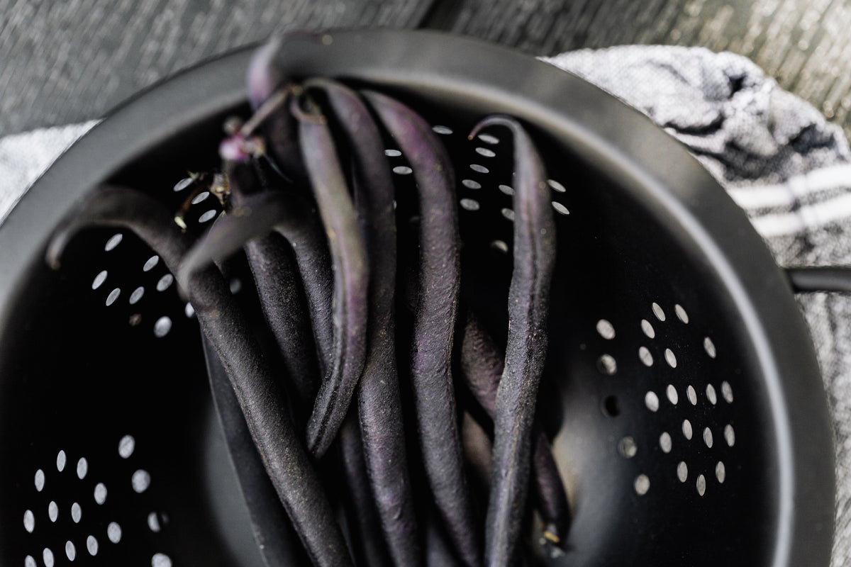 Silicone colander draining fresh beans after rinsing